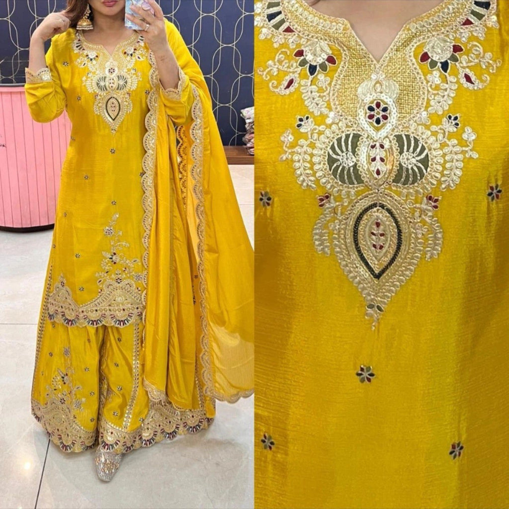 Woman wearing a vibrant yellow Chinon Silk Sharara Suit with detailed gold and multi-color embroidery.