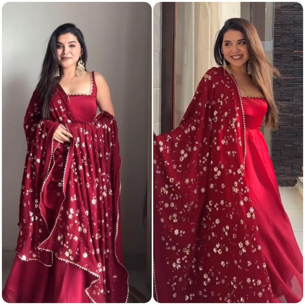 TRENDBUY model in maroon faux georgette gown with sequence work dupatta, smiling elegantly.