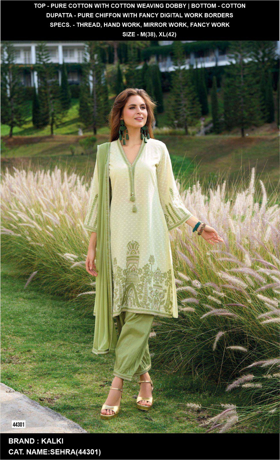 Model wearing a pale green cotton kurta set with mirror and thread work, chiffon dupatta, set against a lush green outdoor background.