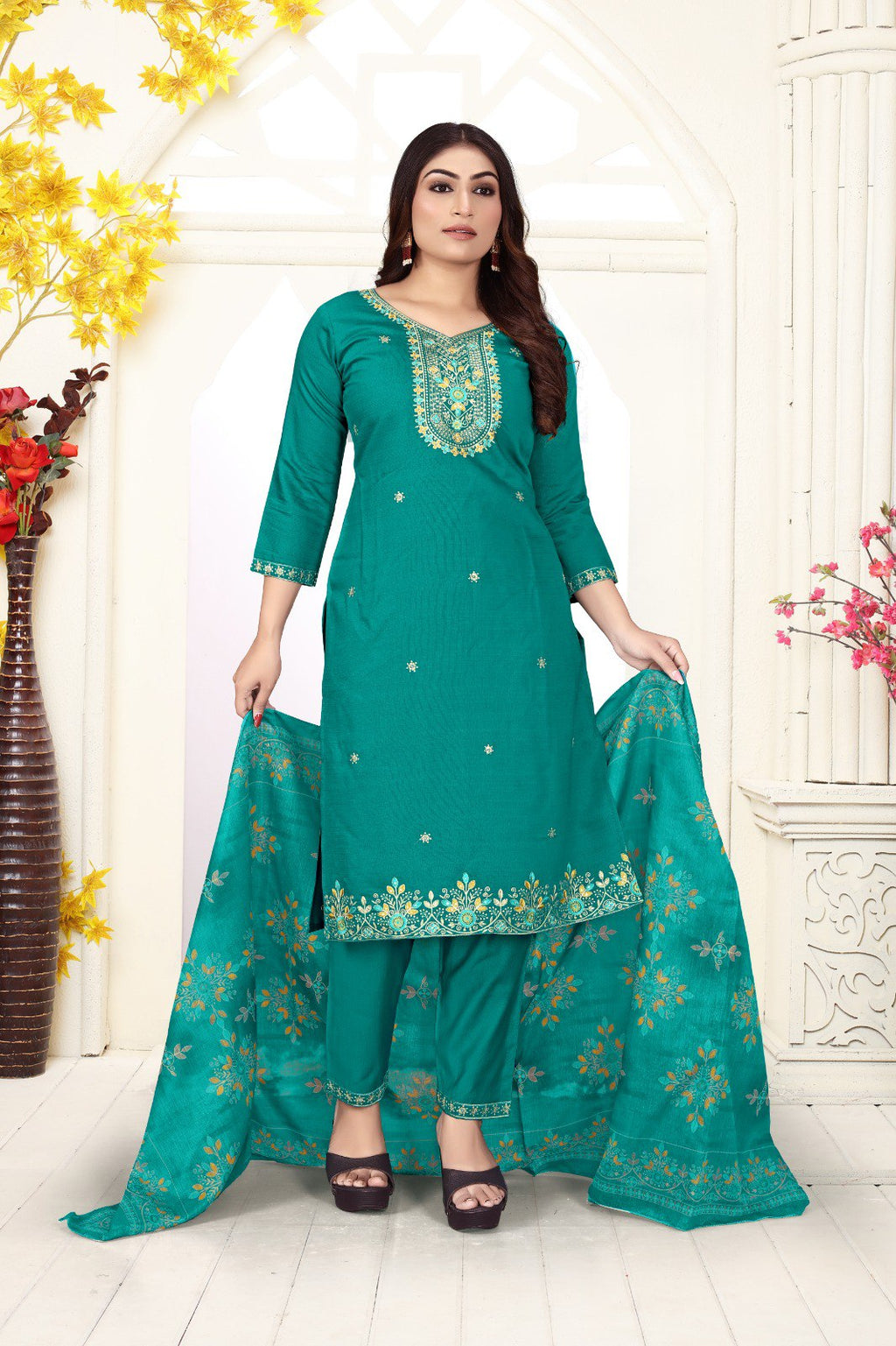 TRENDBUY Manmohini Teal Embroidered Salwar Suit Set with Jacquard Organza Dupatta worn by model in a bright setting