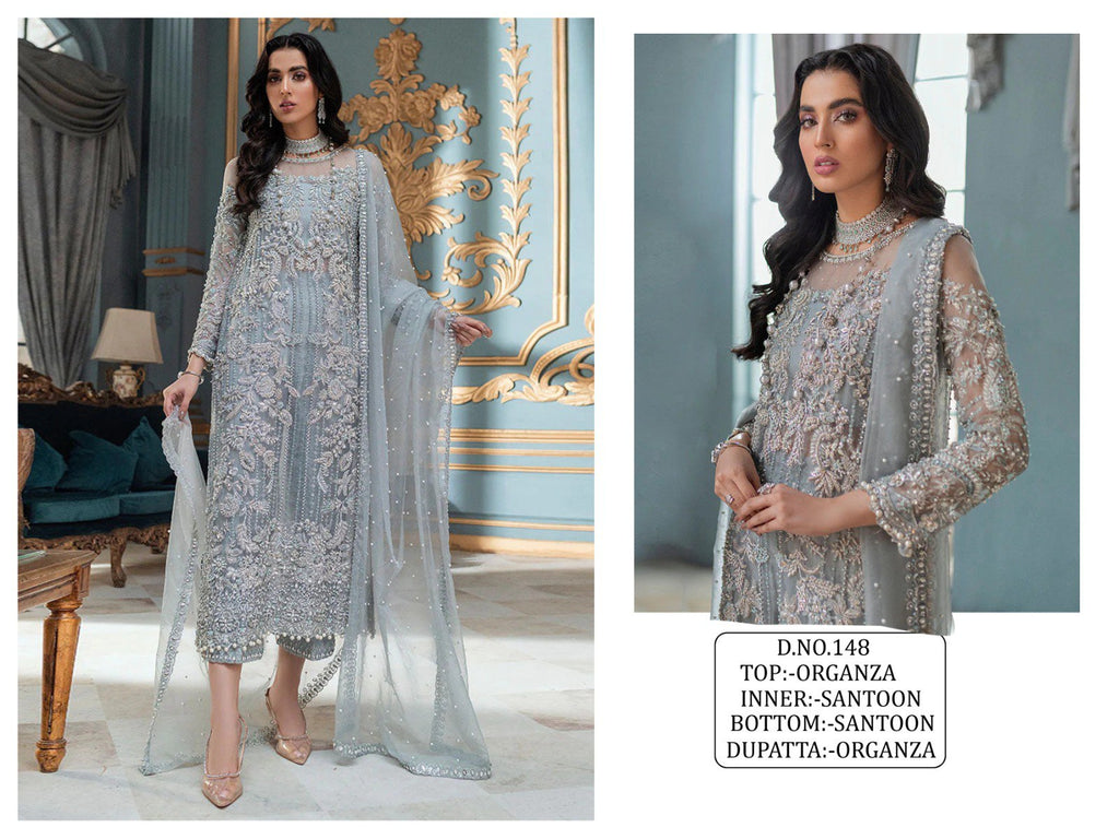 Model showcasing TRENDBUY's grey-blue Pakistani organza suit with intricate sequence embroidery and matching dupatta.