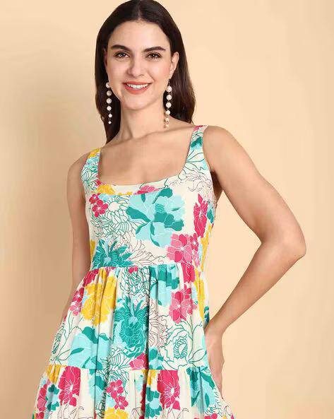 Close-up of a smiling woman wearing the TRENDBUY vibrant floral cotton maxi dress, showcasing the square neckline and colorful print.