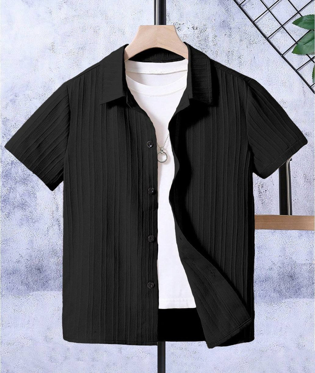 TRENDBUY kids black short sleeve shirt with unique popcorn sugar cane texture, worn open over a white tee, hanging on a display.