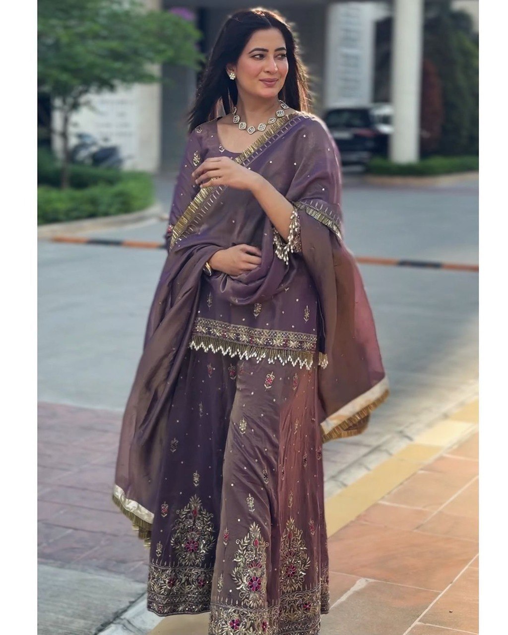Elegant woman in TRENDBUY purple gold net embroidered palazzo suit with dupatta, front view