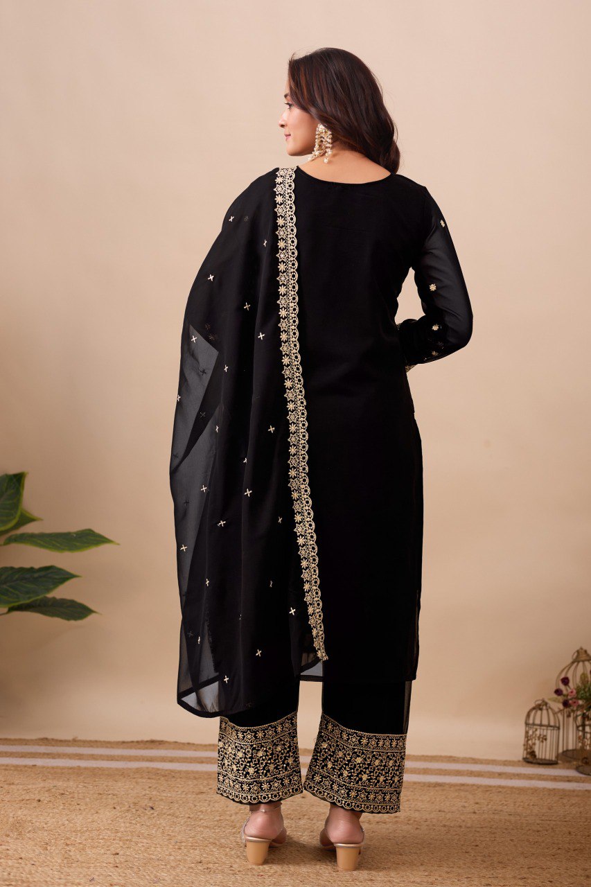 Full back view of model in black embroidered georgette pant suit with dupatta, posing elegantly.