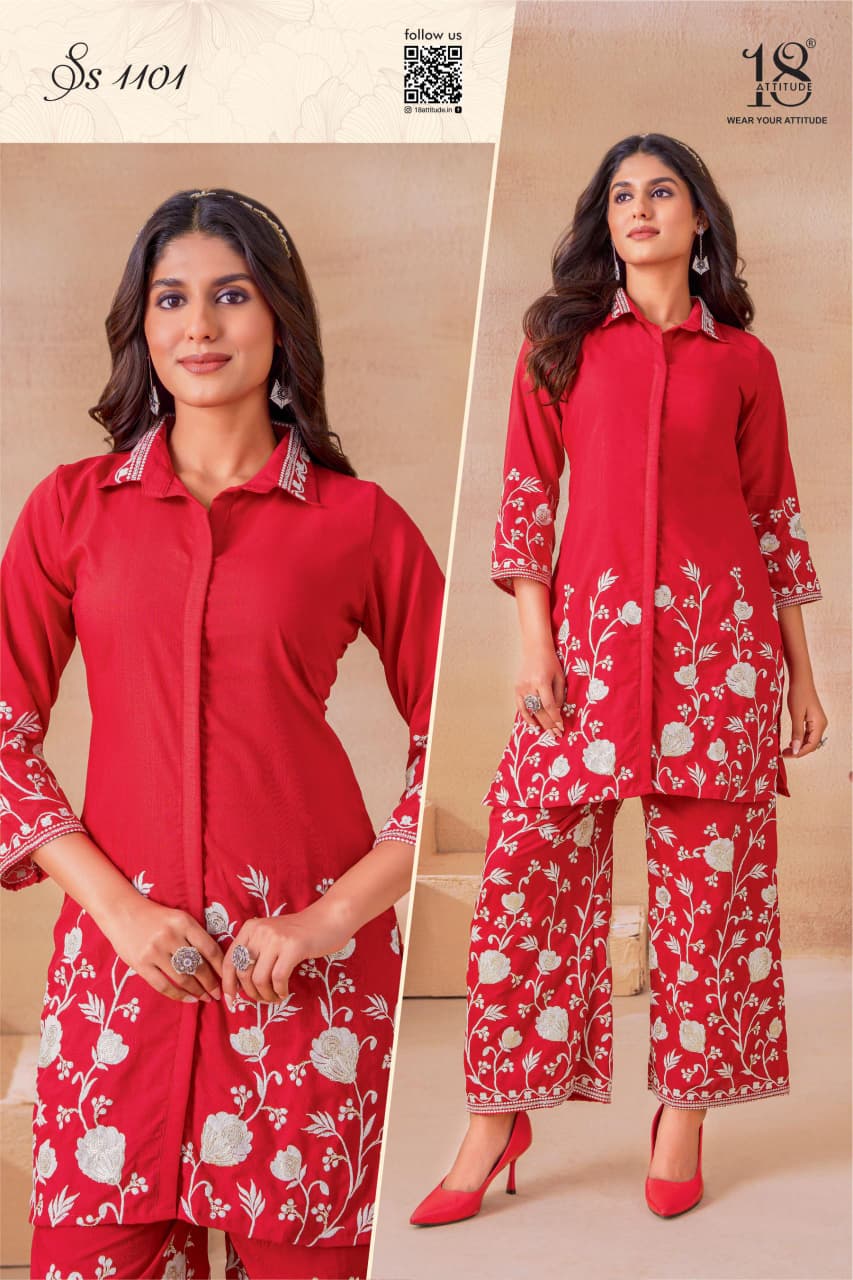 Model posing in a vibrant red embroidered rayon cord set (SS 1101), showcasing front detailing and full length.