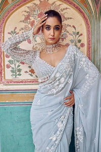 TRENDBUY Premium Aqua Blue Georgette Saree with Exquisite Thread Embroidery & Sequins | Unstitched Blouse