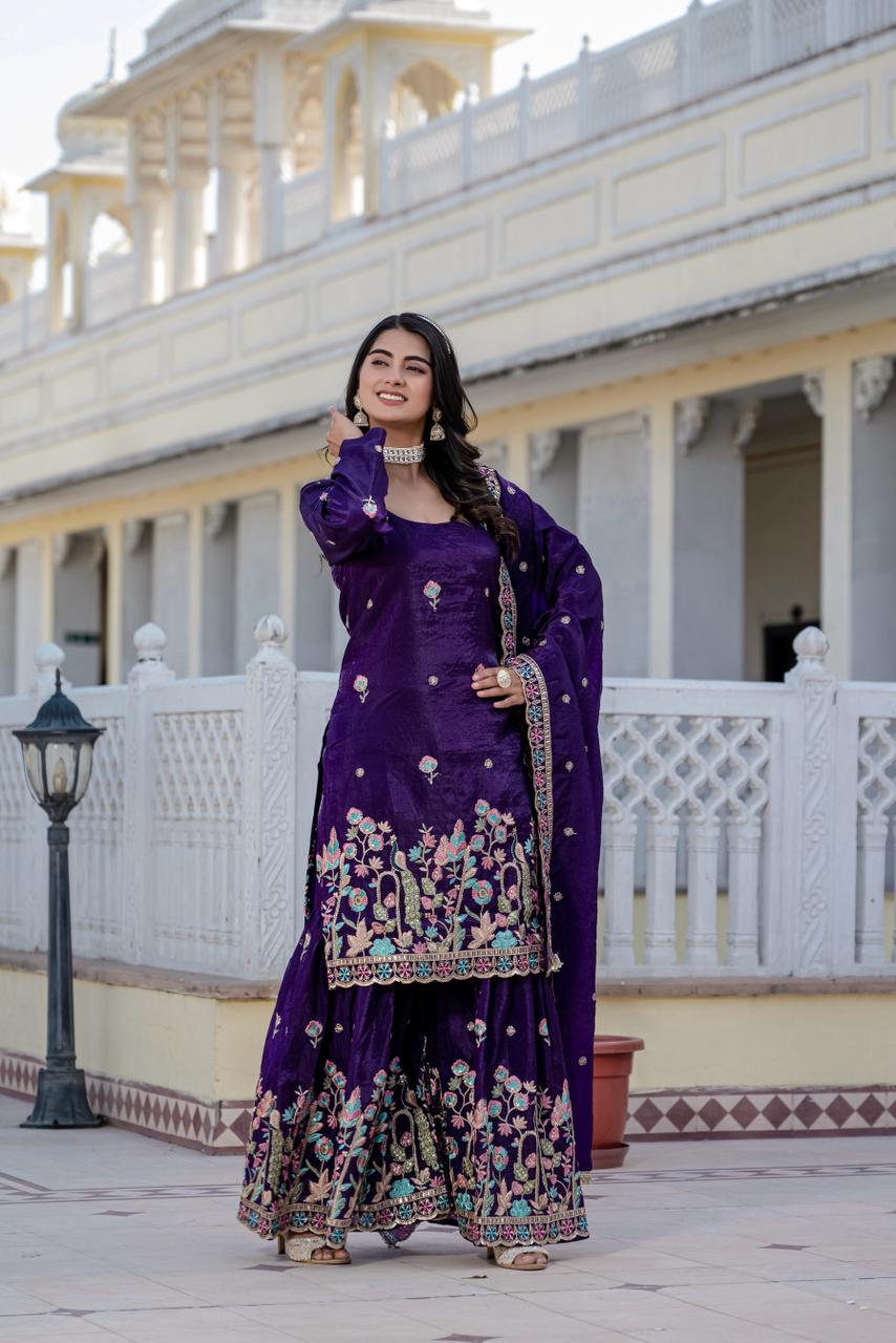 TRENDBUY model smiling in purple Gold Crush kurti plazzo set with heavy embroidery.