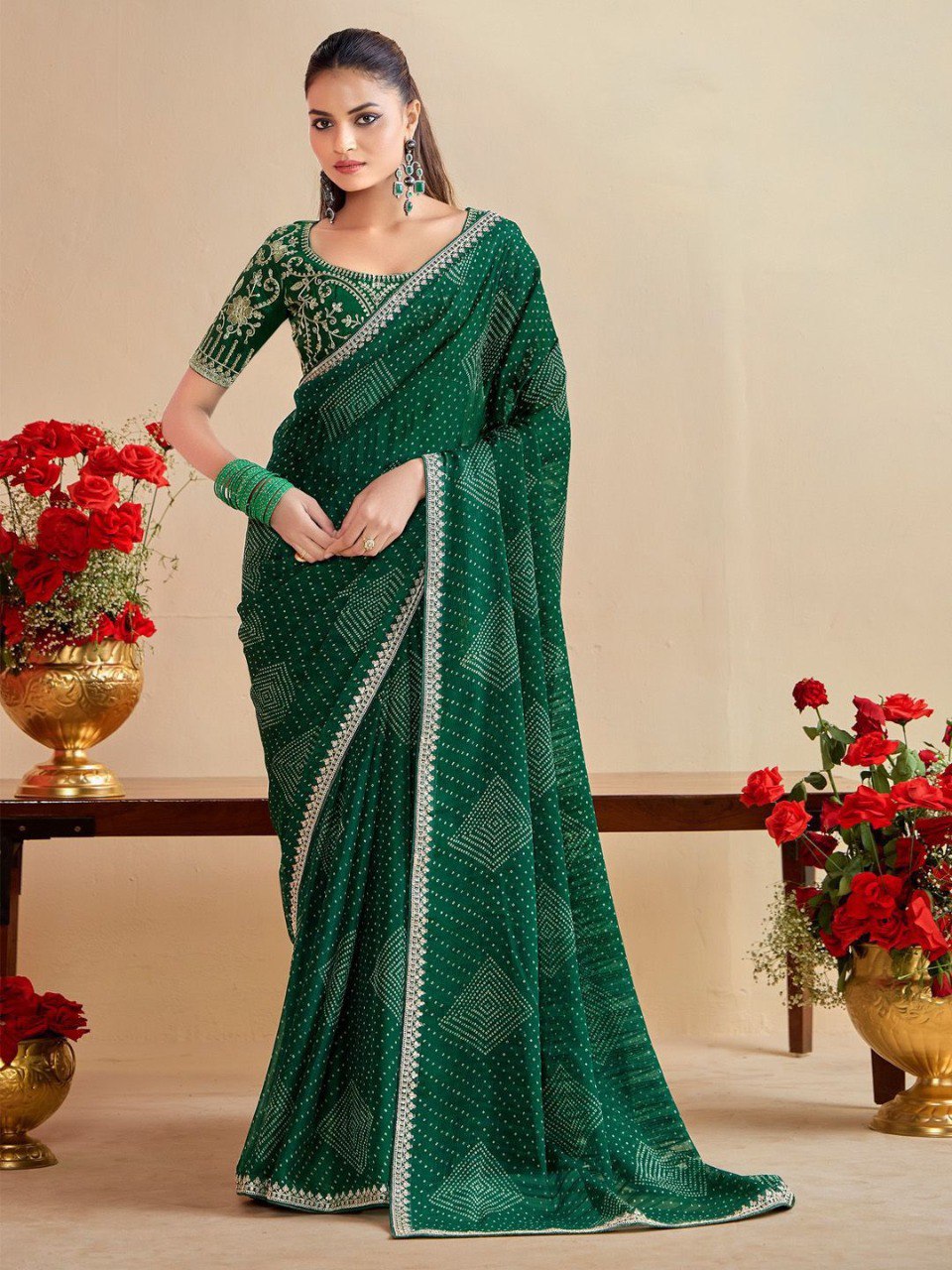 Model in elegant Emerald Green Moss Chiffon Bandhani Saree with embroidered Banglory silk blouse.