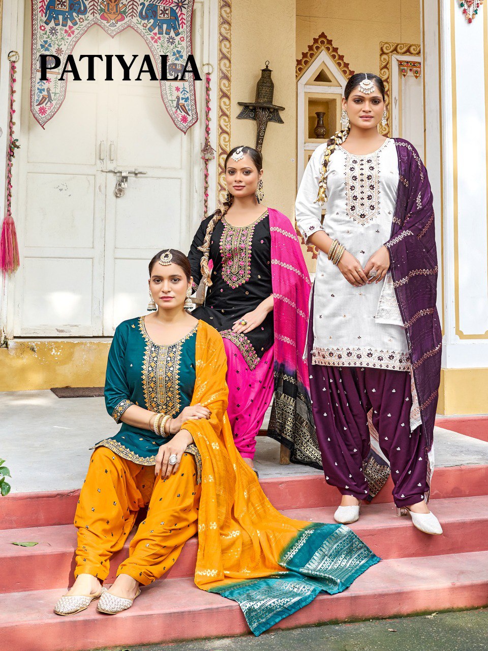 Three models showcasing TRENDBUY Patiyala Kurti sets in yellow/green, black/pink, and white/purple, featuring intricate embroidery.