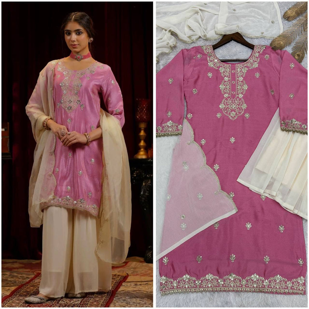 Model showcasing TRENDBUY pink Chinon silk kurti set with embroidered details, white palazzo, and sheer dupatta.
