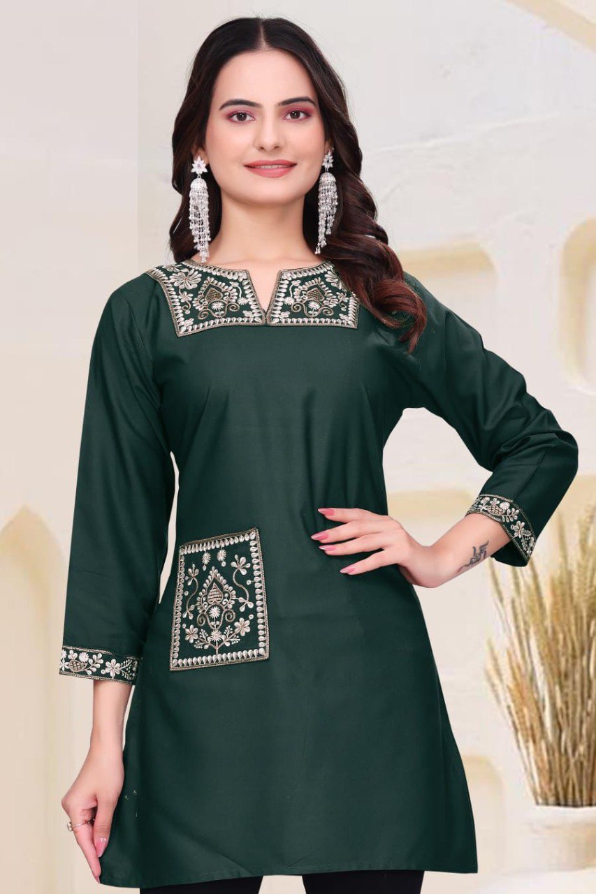 Model wearing Dark Teal heavy rayon kurti with elegant silver-gold embroidery, front view with hand on hip