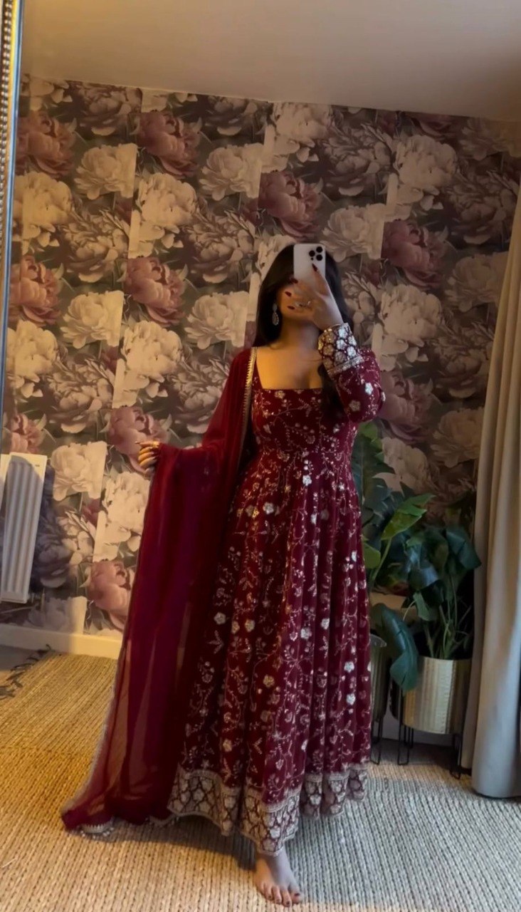 Model showcasing TRENDBUY's elegant maroon embroidered Anarkali gown with dupatta, full flair.