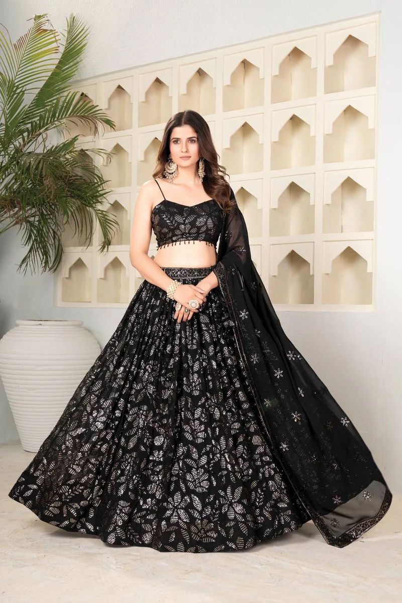 Model showcasing TRENDBUY Black Georgette Sequins Lehenga Choli set for festive occasions
