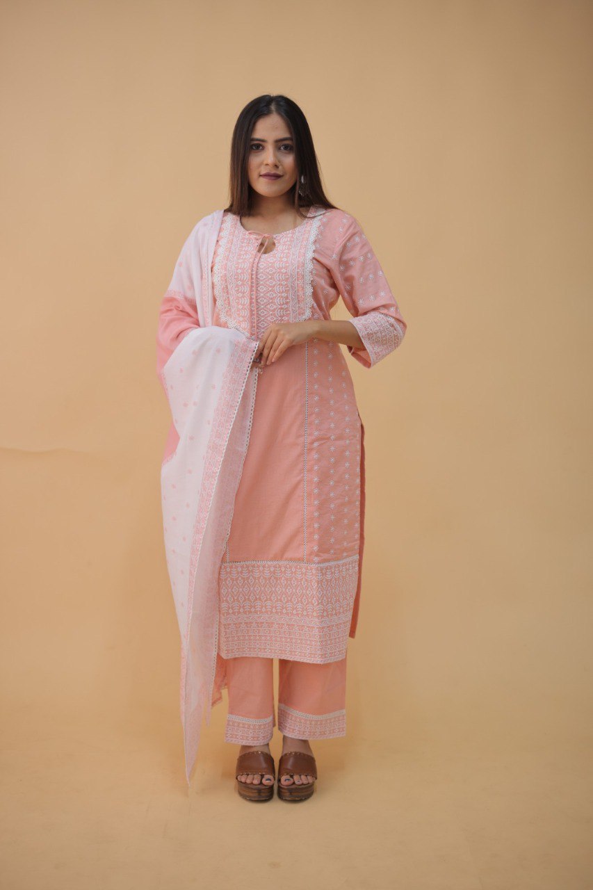 Model in elegant peach cotton salwar suit with shiffli lace and digital print dupatta, full view.