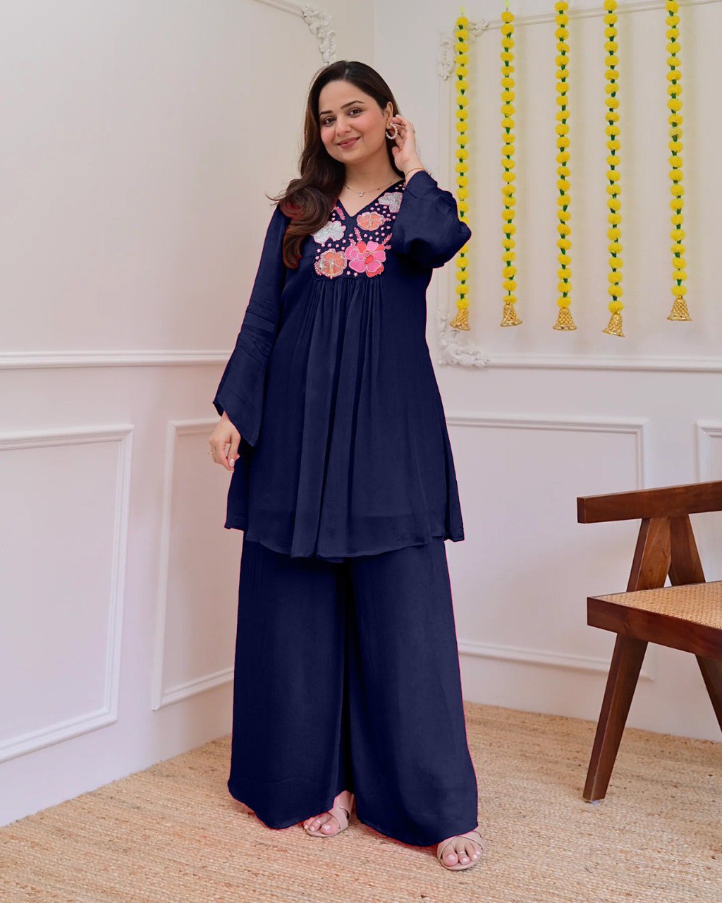 Model wearing a navy blue embroidered Georgette co-ord set, full length, showcasing elegant festive attire.