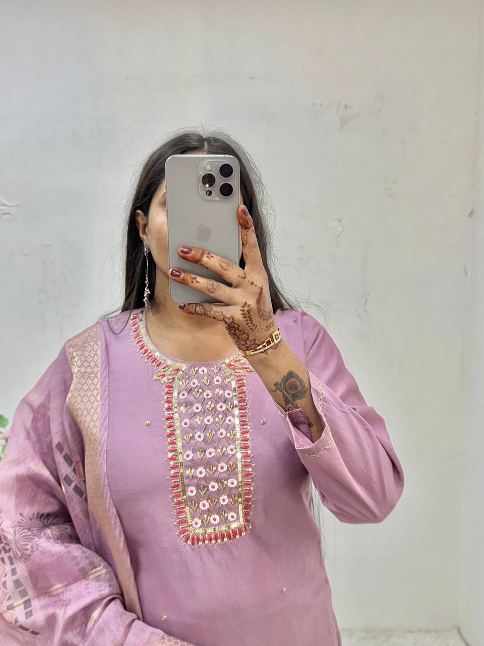 TRENDBUY woman taking mirror selfie, showcasing lavender Gadwal Kurti set with intricate handwork neck embroidery