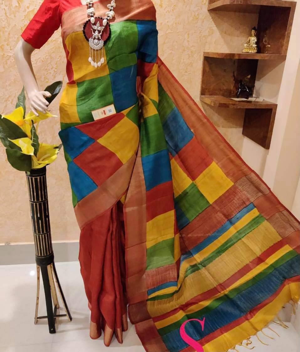 TRENDBUY Multi-color geometric block print linen saree with gold zari border, draped on a mannequin.