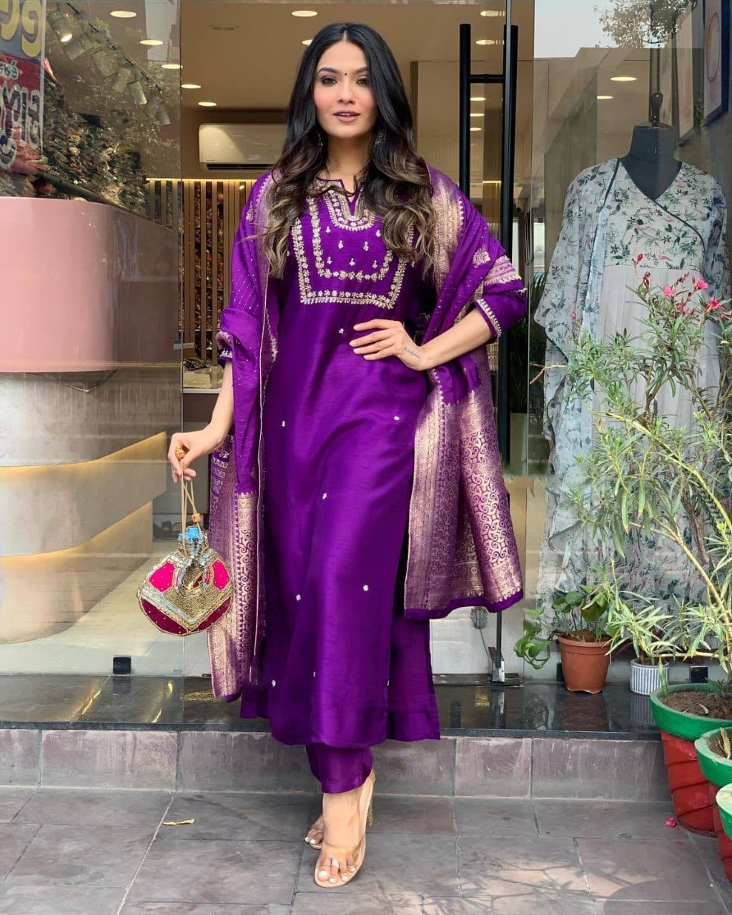 Model in purple embroidered cotton slub kurta set with heavy jacquard dupatta, showcasing festive ethnic wear.