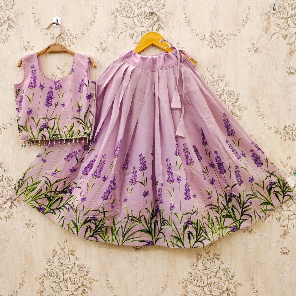 Full view of the kids' lavender floral lehenga choli set on a hanger, showcasing the pleated skirt and embellished choli.
