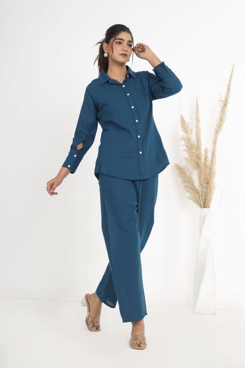 Full-length shot of a woman modeling the TRENDBUY Teal Blue Cotton Slub 3-piece co-ord set, showcasing the button-down top and trousers.