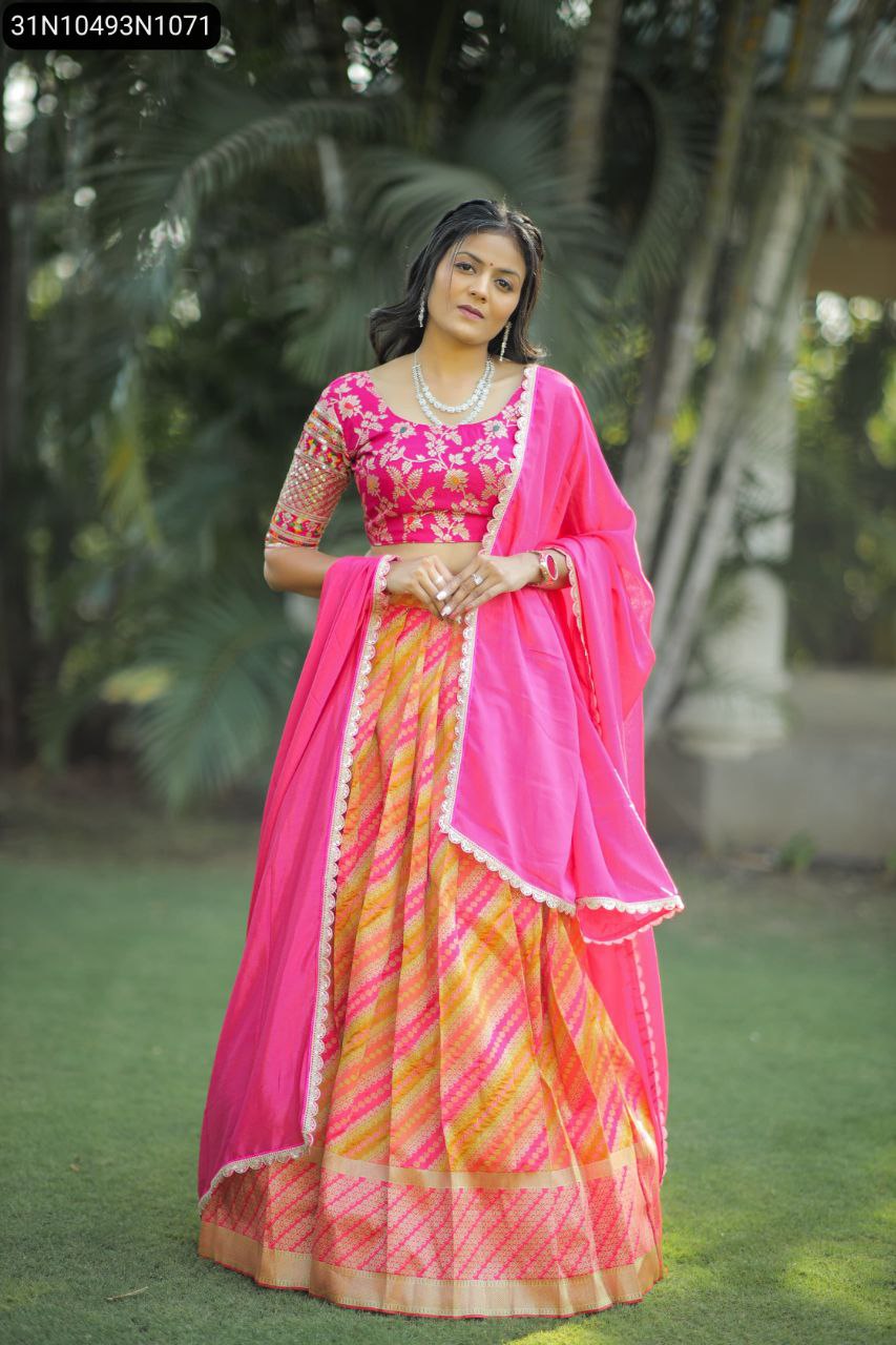 Full shot of model in elegant pink and yellow lehenga choli, standing frontally, showcasing the full ensemble's design and drape.