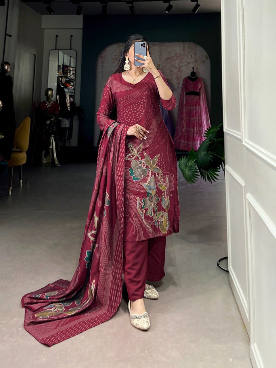 Model showcasing a maroon Roman Silk Salwar Suit with floral print and beadwork.