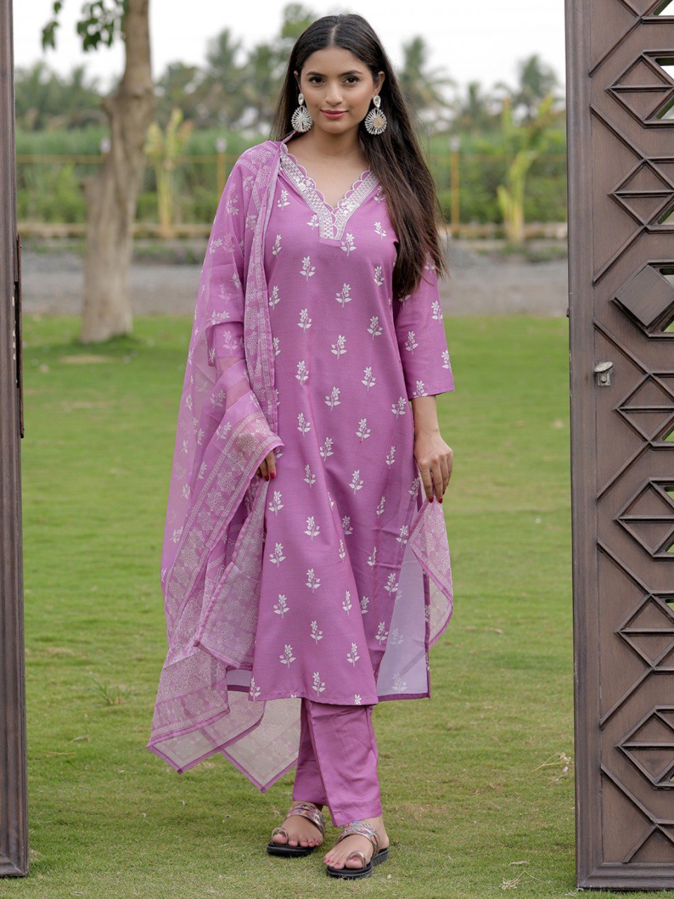 Full shot of model in Onion/Lilac Rayon Kurti Set with Taby Silk Dupatta, standing outdoors.