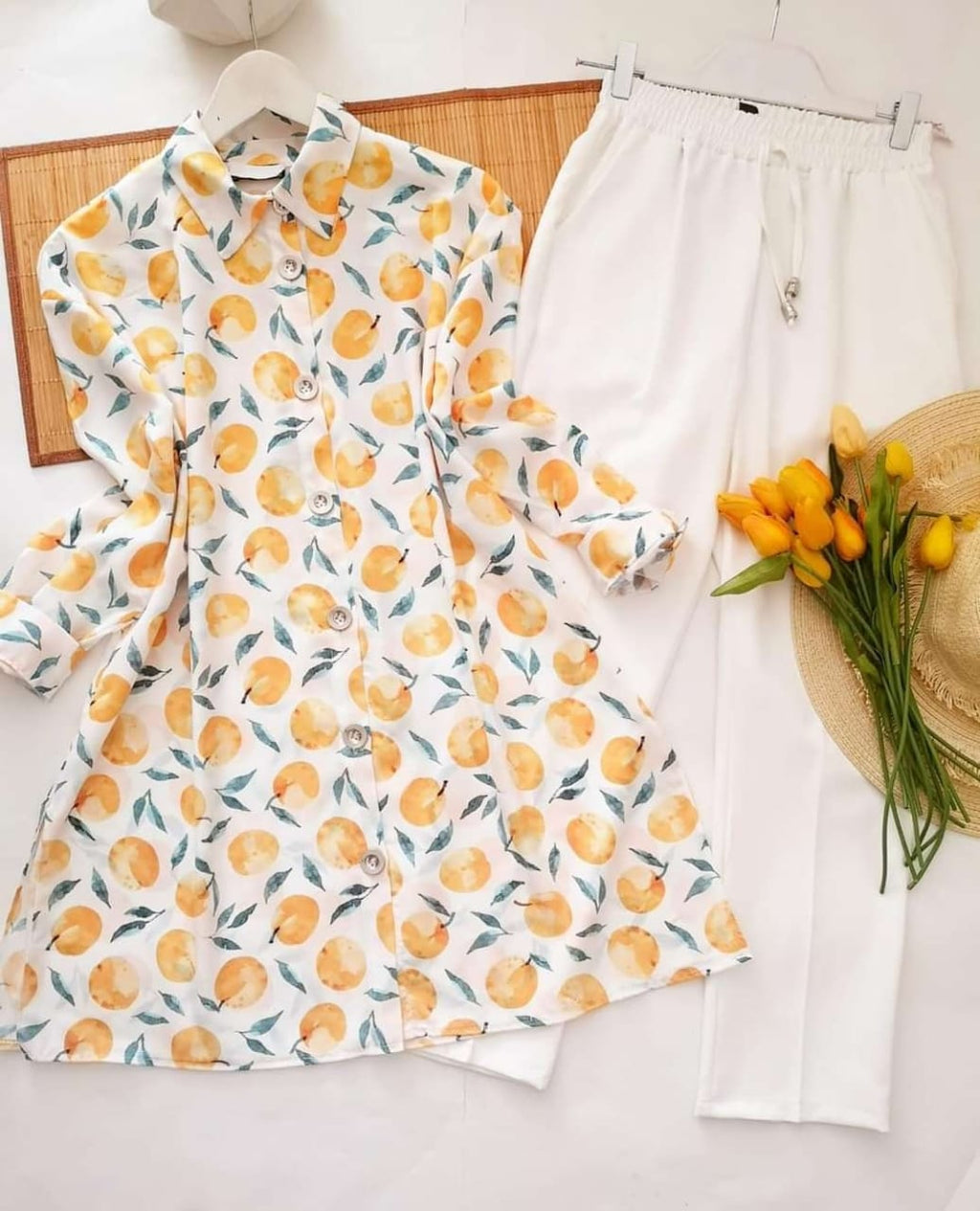 TRENDBUY white base kurti with yellow orange fruit digital print paired with white lycra palazzo pants