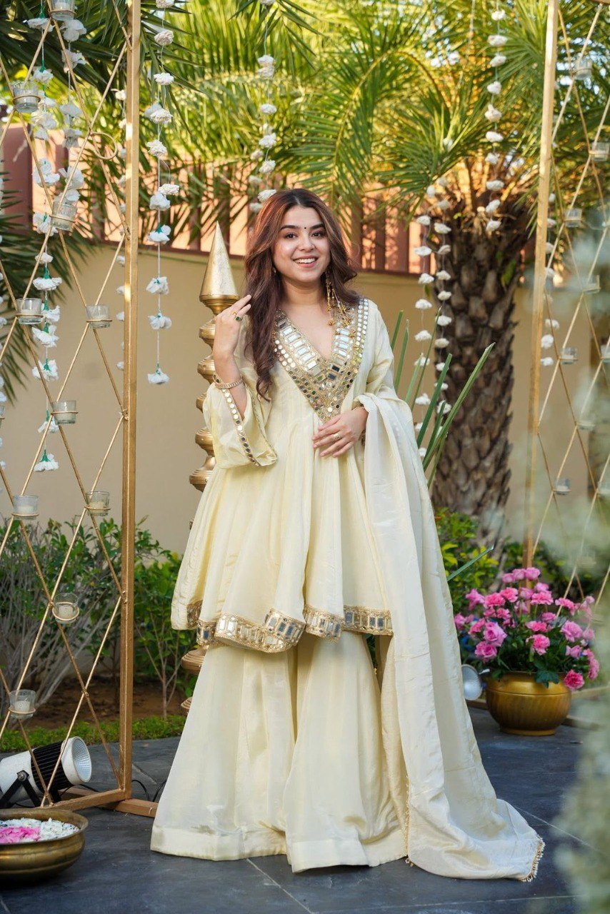 Designer party wear top and plazzo set in cream color