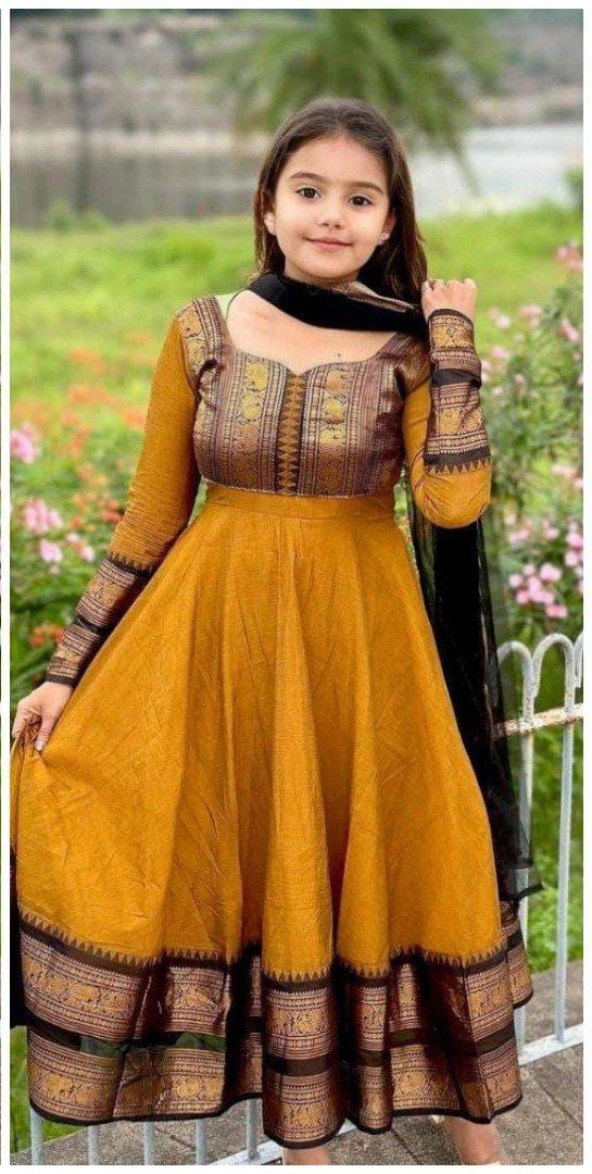 Little girl in Golden Yellow Vichitra Silk Pattu Zari Kids Gown with black dupatta, TRENDBUY