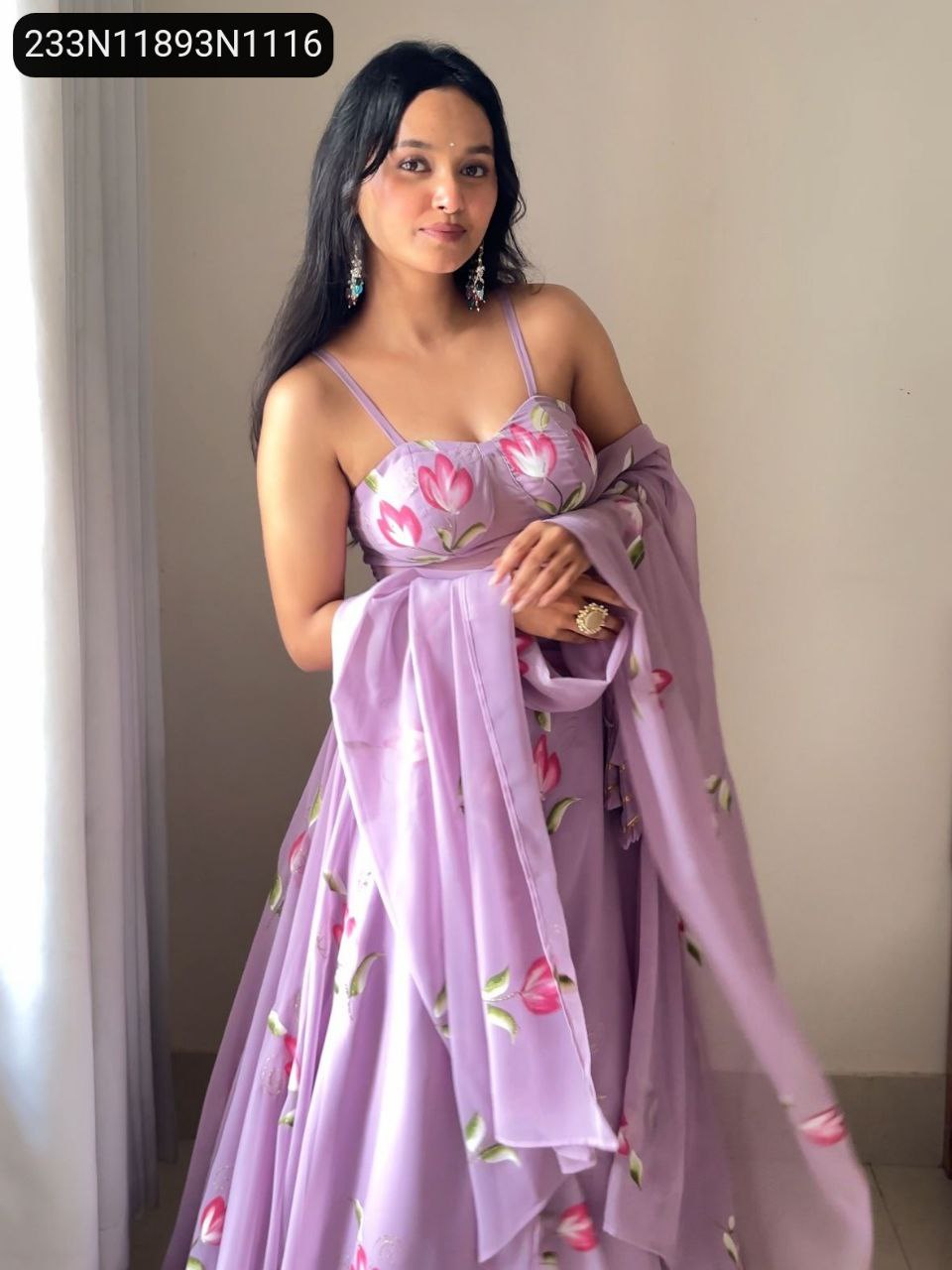 Front view of model wearing a lavender hand-painted Georgette lehenga set