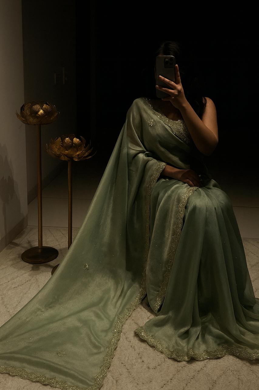 Woman posing in elegant Pistachio Green Sequined Silk Saree from TRENDBUY