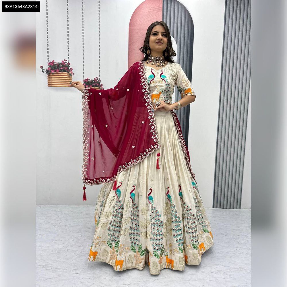 Front-facing model showcasing the off-white lehenga choli with deep maroon dupatta, main image.