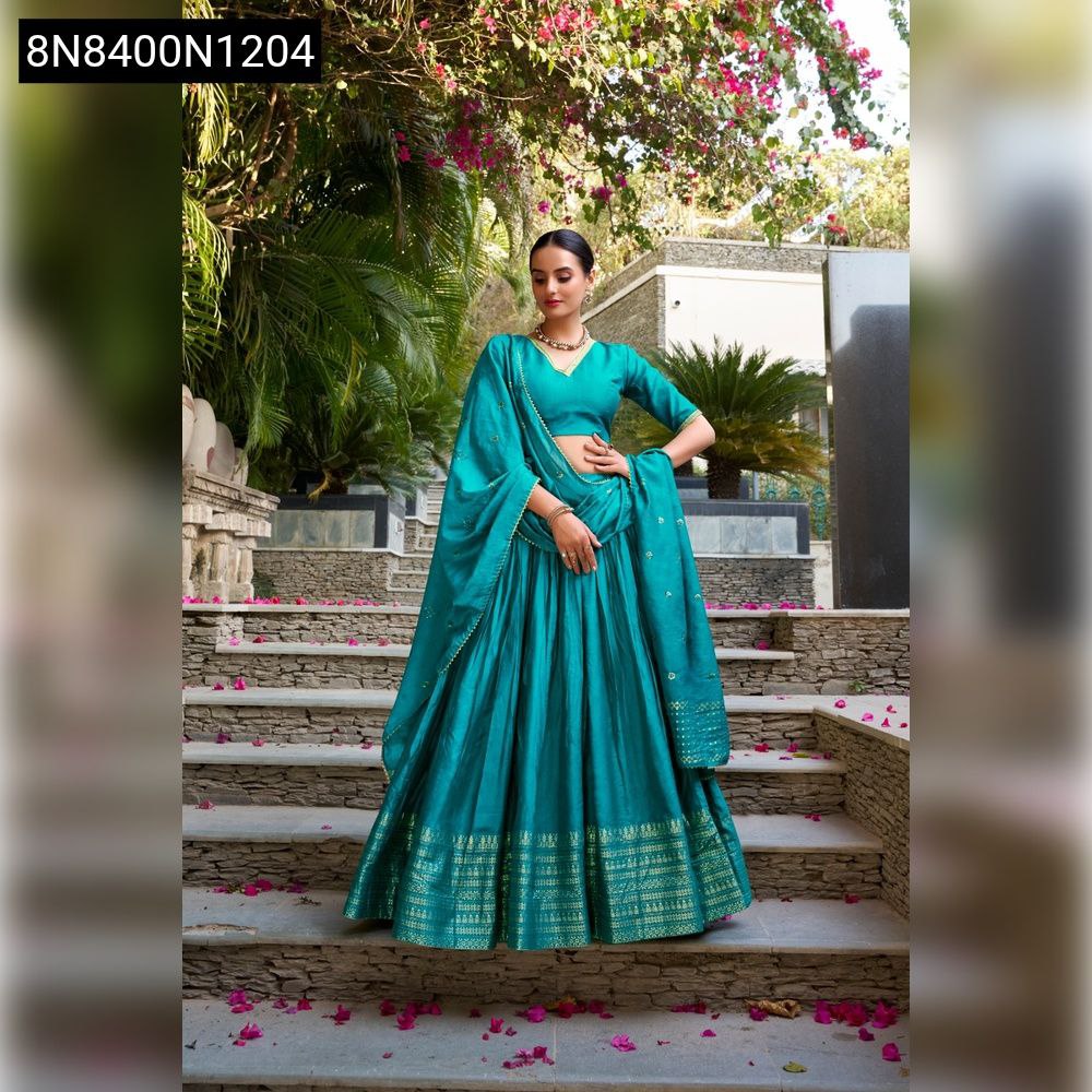 TRENDBUY Teal Pure Chanderi Lehenga Choli with Zari border and sequin dupatta, modeled front-on on stairs.