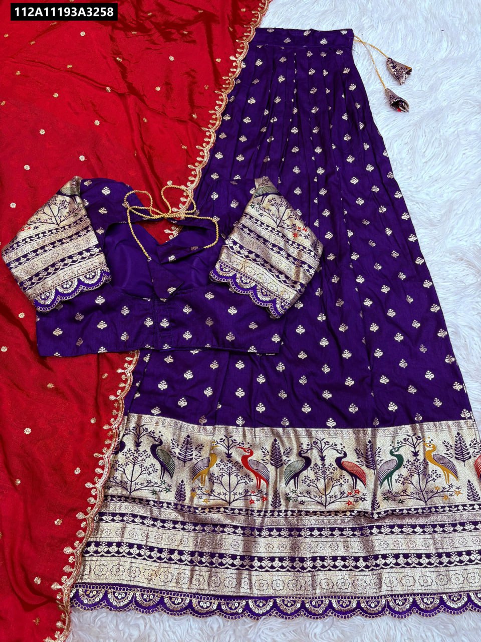 Purple lehenga, purple blouse, red dupatta with gold jacquard border and colorful bird motifs