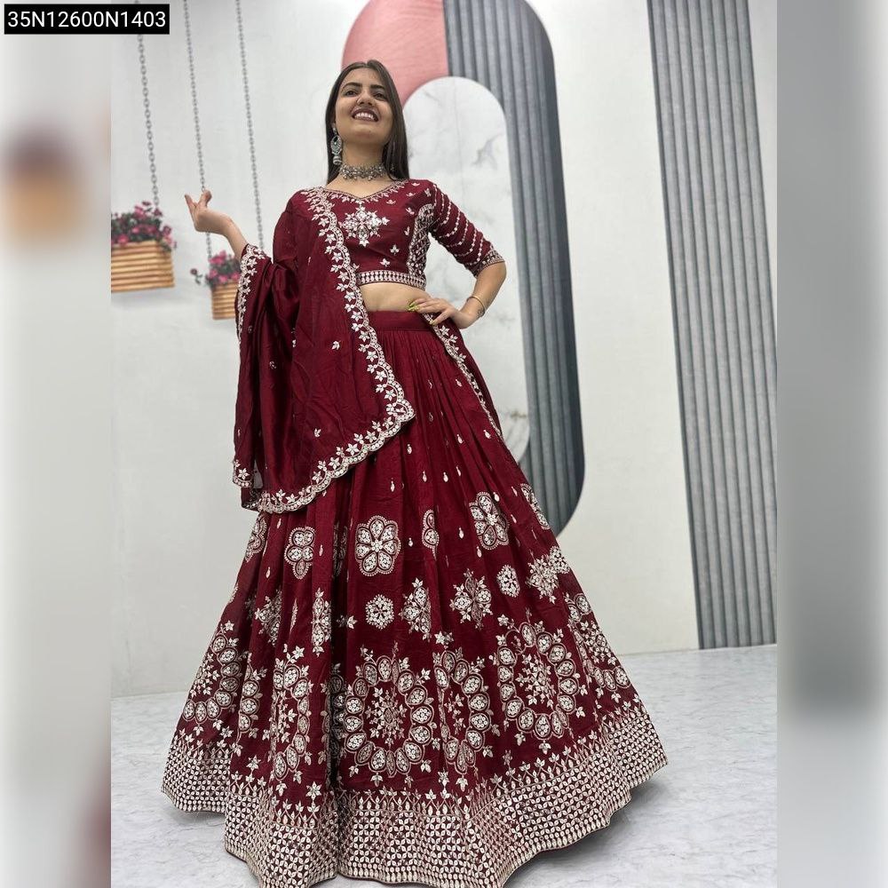 Maroon embroidered silk lehenga with sequins, front view, single model.