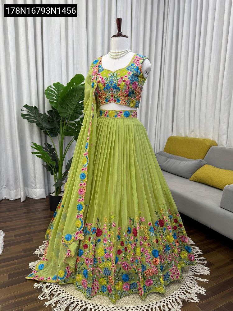 Mannequin showcasing a full view of the lime green tabby organza lehenga choli set with vibrant floral thread and sequin embroidery, from a front-facing perspective.