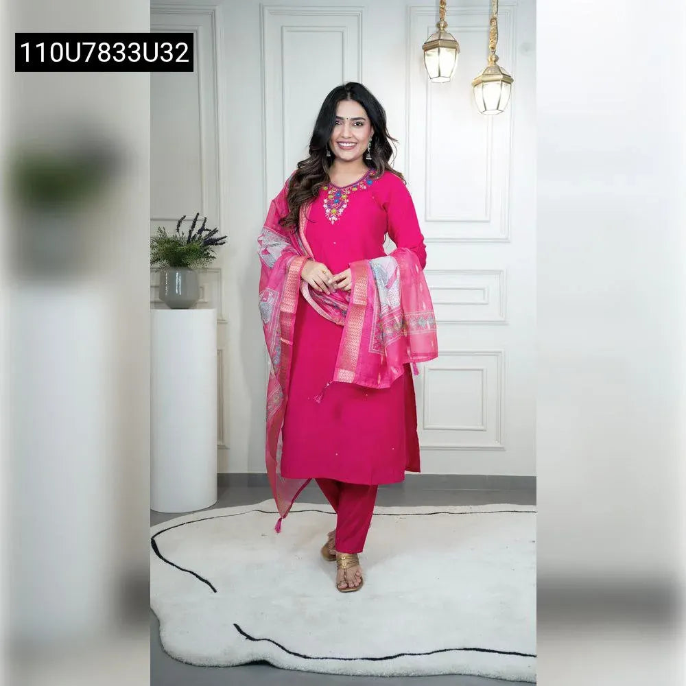 Full body shot of a smiling model wearing the TRENDBUY Pink Roman Silk Kurti Set with hand work and a Chanderi dupatta, standing front-facing in an elegant room.