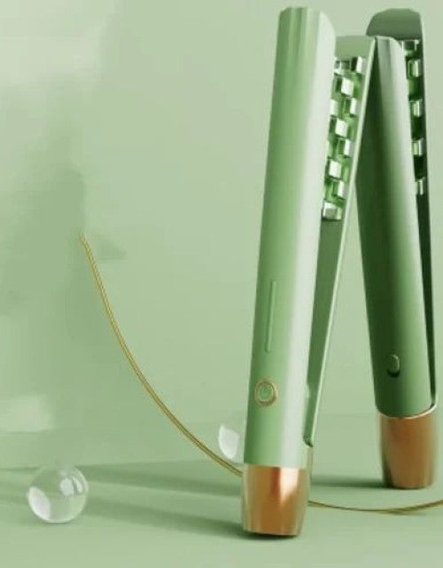 Close-up of the pastel pink ceramic heating plates on a mini flat iron