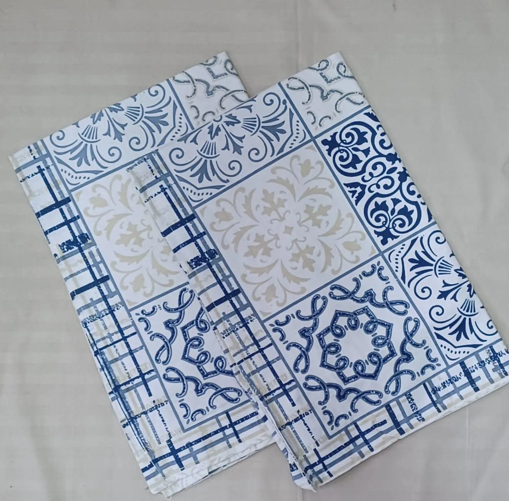 Blue and white geometric patterned pure cotton pillow covers folded neatly