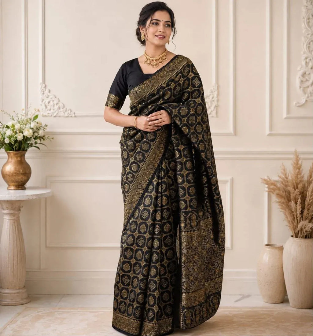 Model wearing black soft lichi silk Banarasi saree with gold motifs