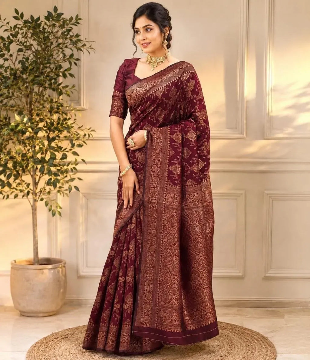 Model wearing maroon Banarasi silk saree with gold jacquard work
