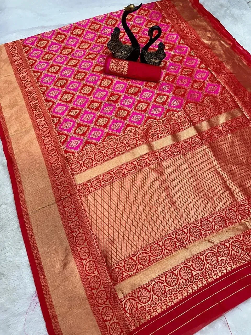 Full flat lay view of pink Banarasi silk saree with matching unstitched blouse