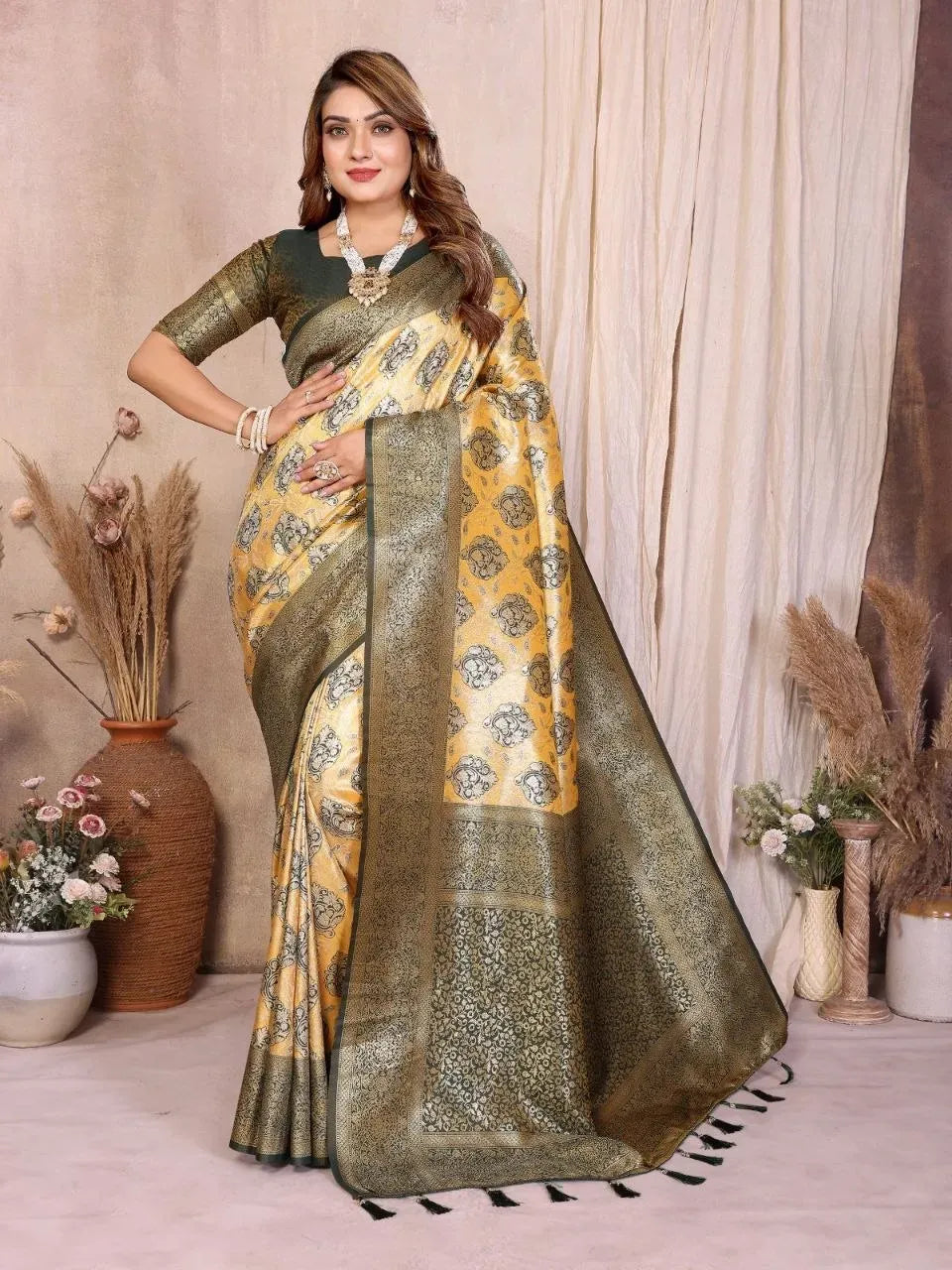 Model wearing yellow and dark green banarasi tissue silk saree front view