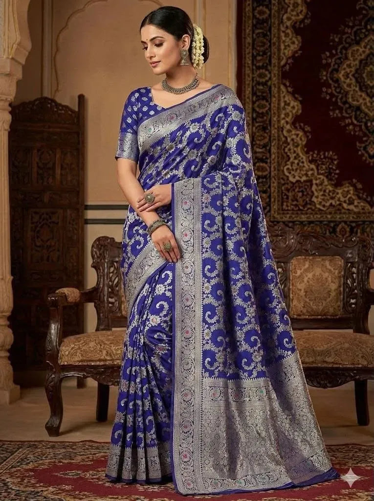 Model wearing royal blue banarasi silk saree with silver zari weaving