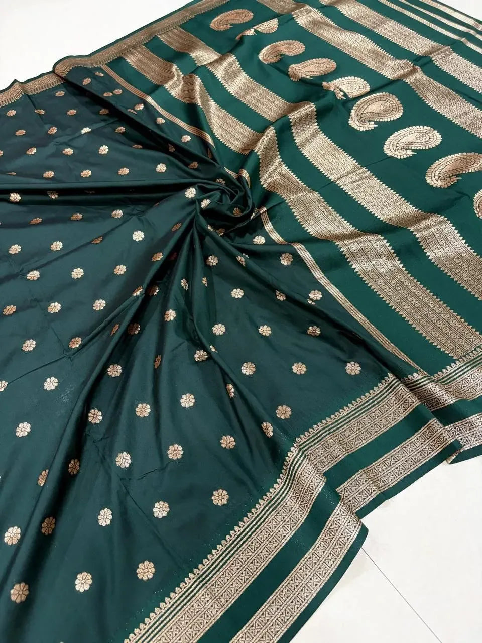 Dark green Banarasi silk saree with gold zari motifs and rich border