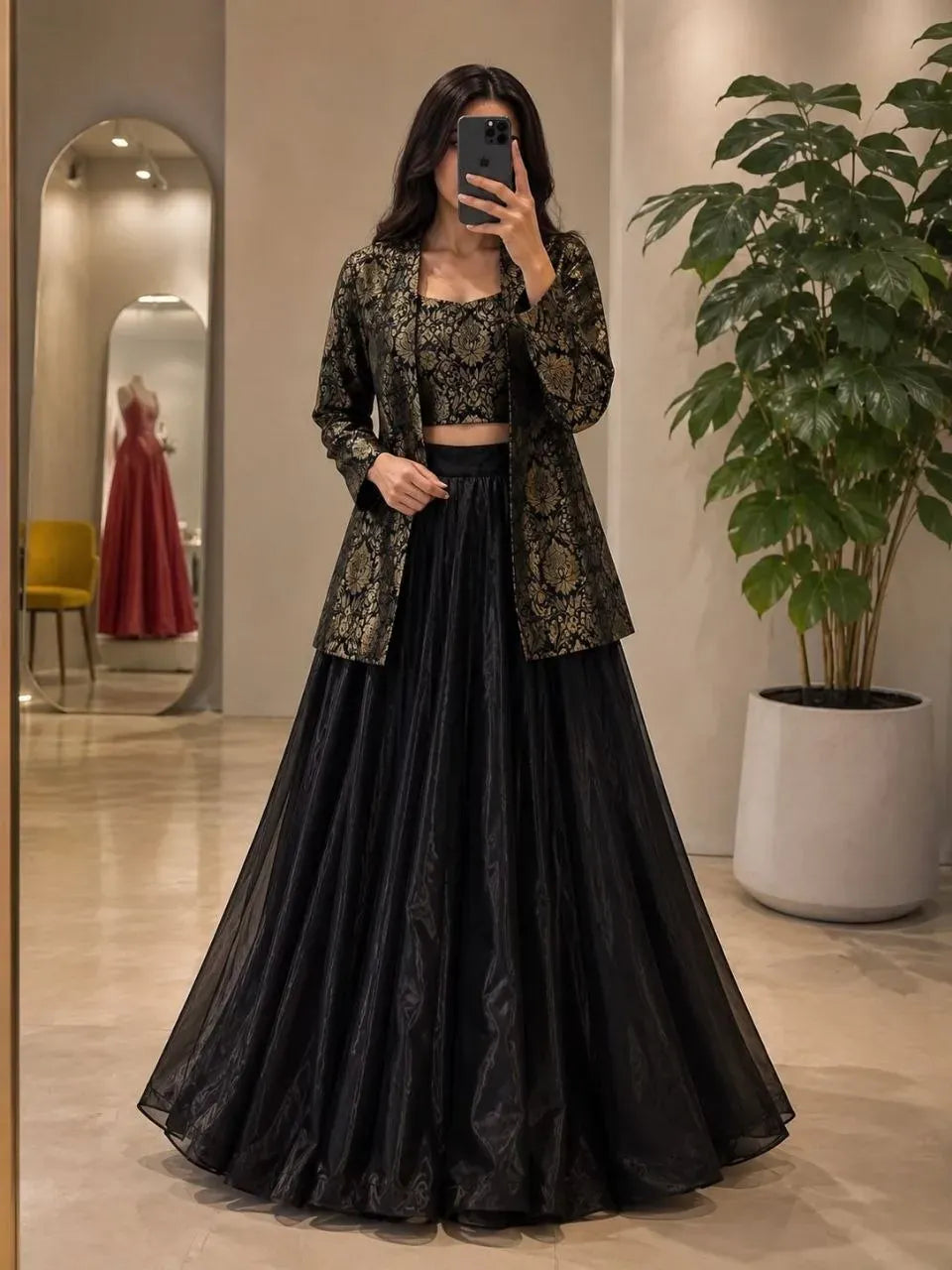 Woman wearing black jacquard jacket and skirt set with crop top