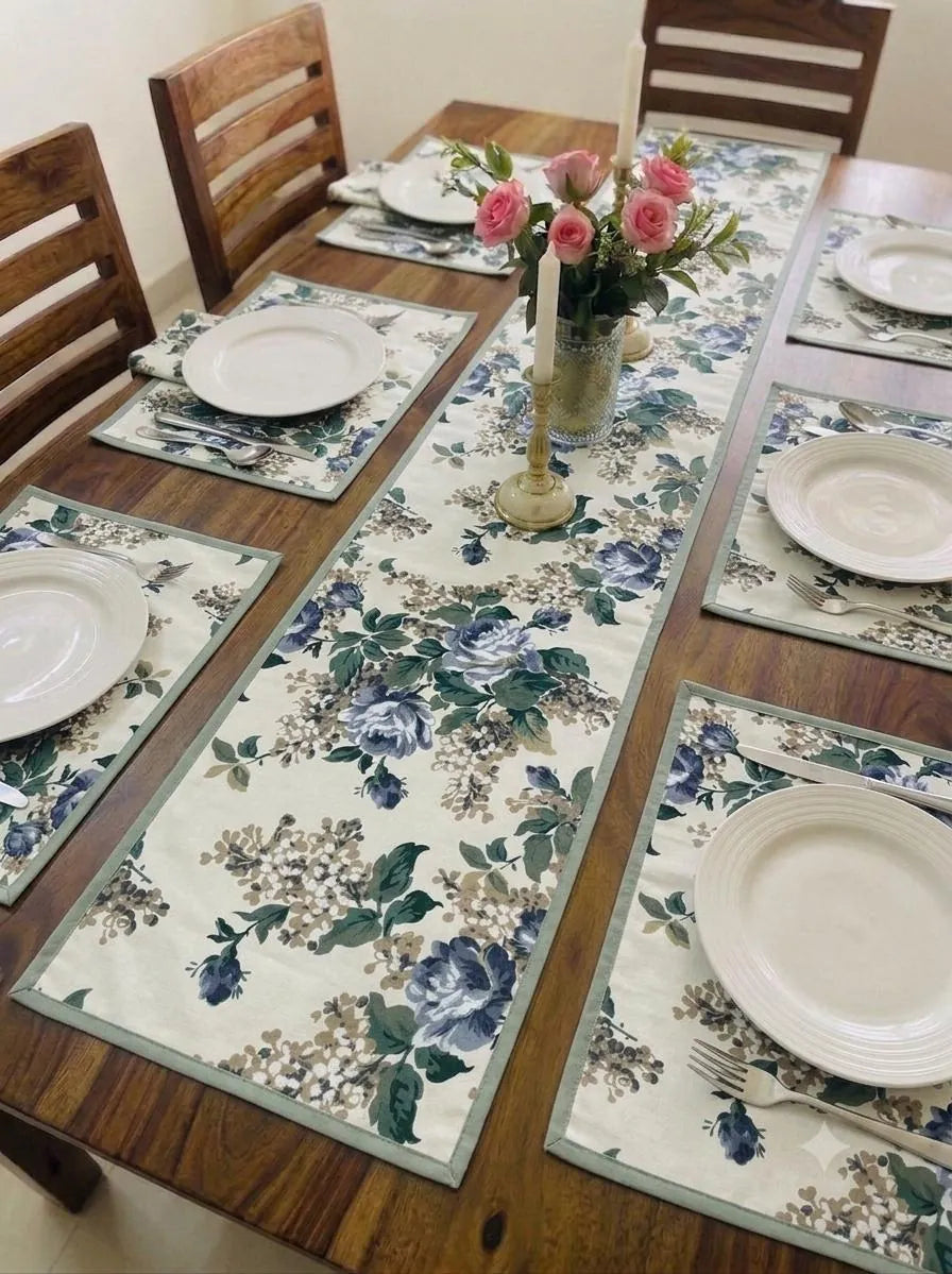 Casemat table runner and placemat set with blue floral print on wooden dining table