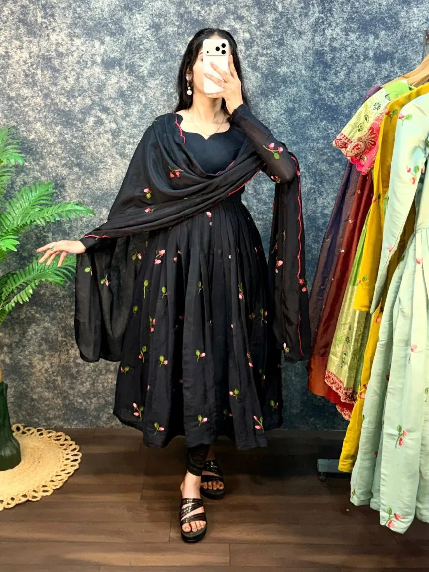 Model wearing a black South Mull Chanderi Anarkali suit with delicate pink floral embroidery and a matching dupatta